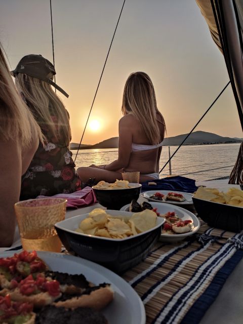 Alghero: Sunset Sailing Aperitif Experience - Sailing out from Alghero Port at sunset