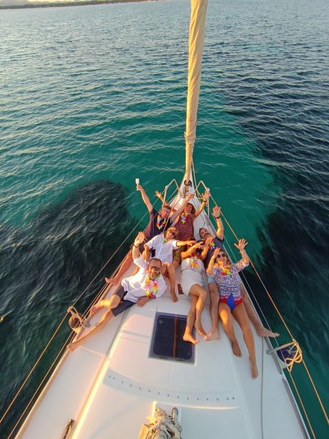Alghero: Sunset Sailing Aperitif Experience - Swimming and snorkeling in clear water