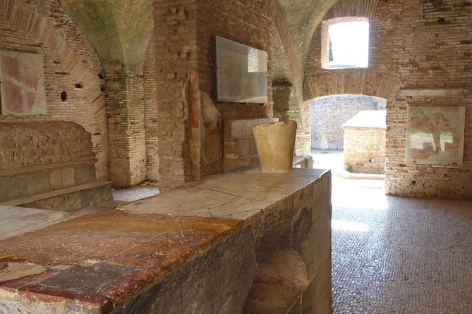 Ancient Ostia Antica Semi-Private Day Trip from Rome by Train with Guide - The Baths of Neptune and their remarkable mosaic