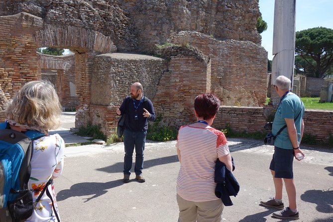 Ancient Ostia Antica Semi-Private Day Trip from Rome by Train with Guide - Sitting in the amphitheater