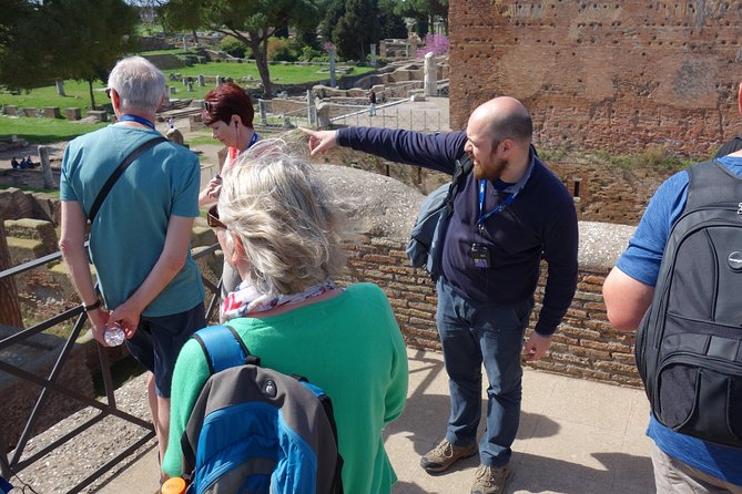 Ancient Ostia Antica Semi-Private Day Trip from Rome by Train with Guide - Shops, apartments, taverns, and the Forum of the Corporations