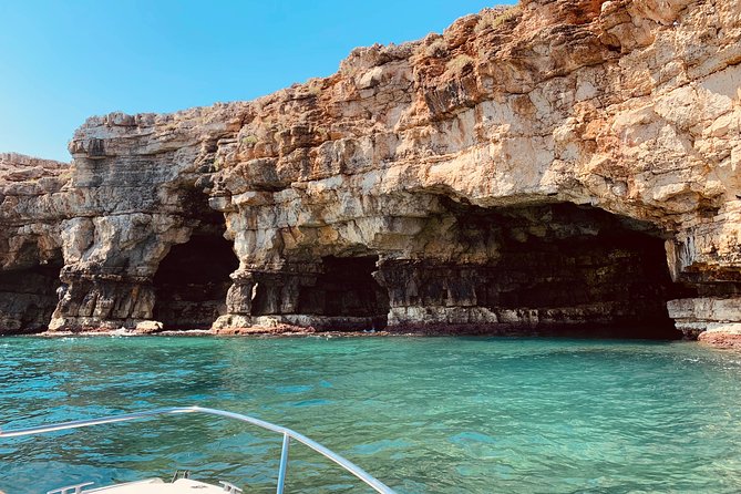 Boat tour of the Polignano a Mare caves with aperitif - Grotta Azzurra and the light beneath Santo Stefano