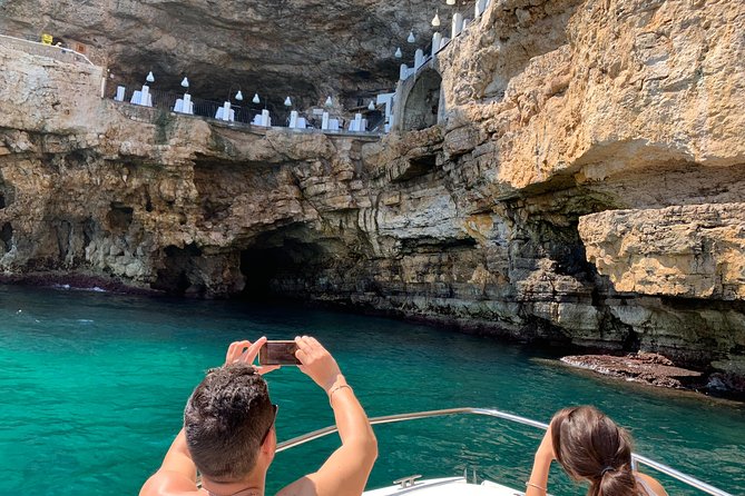 Boat tour of the Polignano a Mare caves with aperitif - Grottone and the odd cinema by the sea