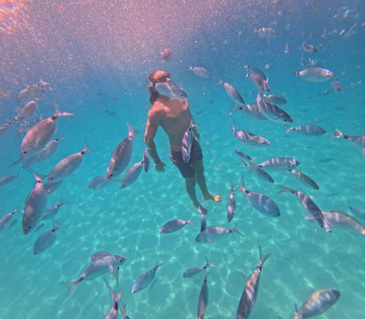 Cagliari: Boat Tour, 4 Stops, Swim, Snorkeling, & 1 Spritz - Cala Fighera is made for photographs and a swim