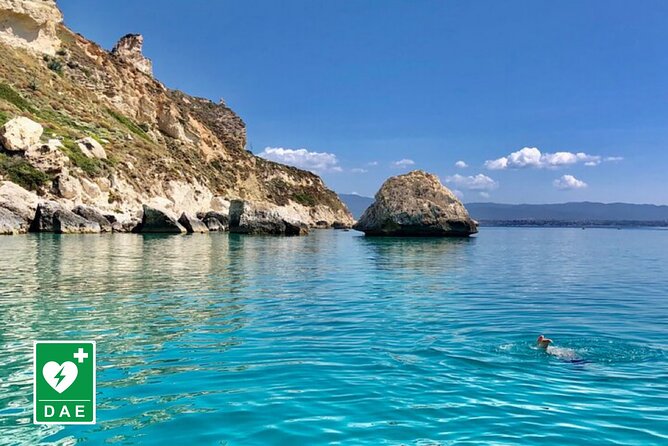 Catamaran tour stops bathing and snorkeling toast with prosecco - Cala Mosca and the first coastal views