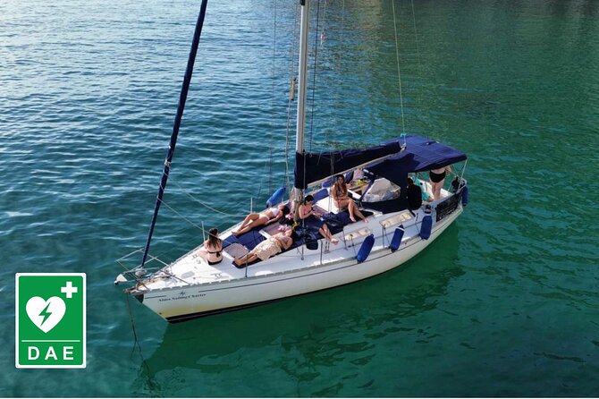 Catamaran tour stops bathing and snorkeling toast with prosecco - Leaving the port with Cagliari at your back