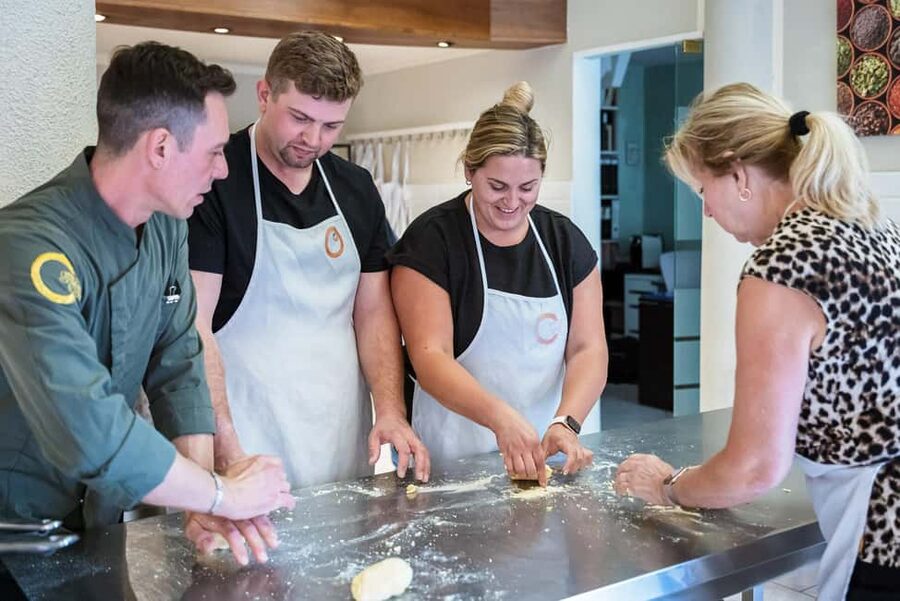 Florence: Handmade Pasta & Dessert Class with Unlimited Wine - Rolling dough by hand and with a machine