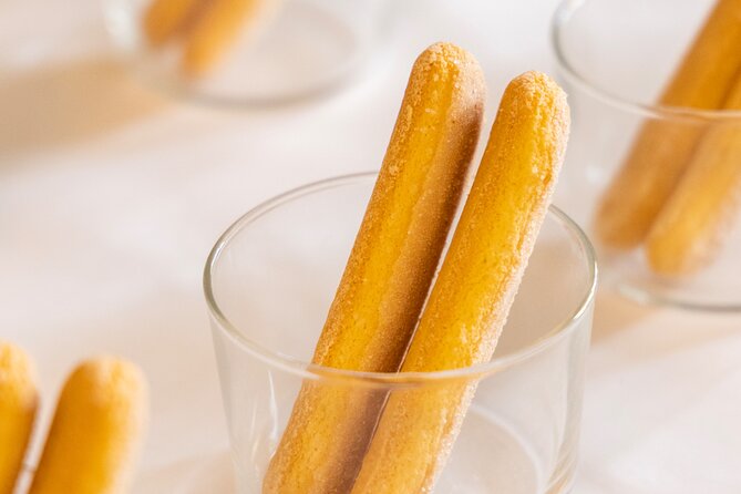 Learn to Make Pasta & Tiramisu with Wine and Limoncello Included - Sitting down for dinner