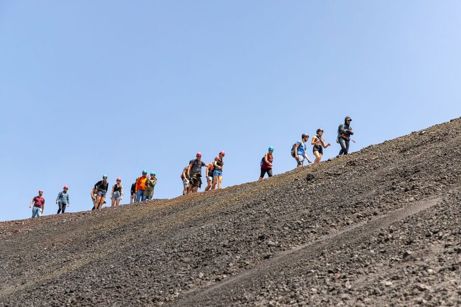 Mount Etna: Guided Volcano Summit Hiking Tour with Cable Car - Descending through volcanic sand to Valle del Bove