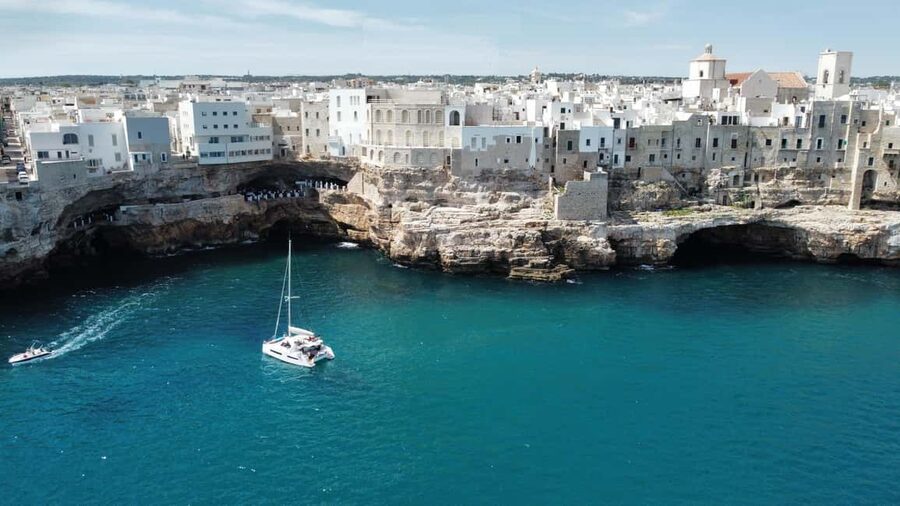 Polignano a Mare: Catamaran Tour with Aperitif & Local Food - Grotta Palazzese and the cave coast