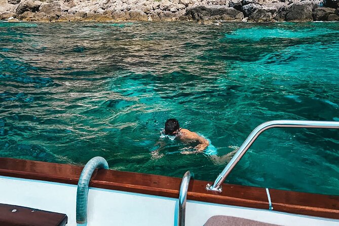 Private Boat Tour of Capri - Passing under the Faraglioni arch
