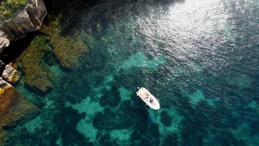 Procida: Boat Tour with Swimming Stops and Underwater Photos - Marina di Corricella from the water