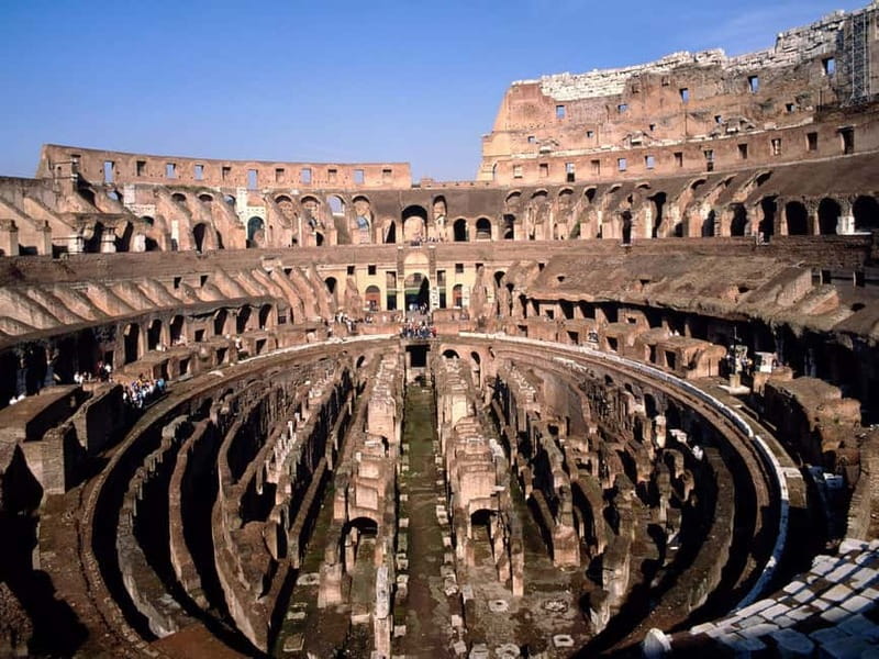 Rome: Colosseum & Forum Small Group Tour with Palatine Hill - Entering the Colosseum on the first and second tiers