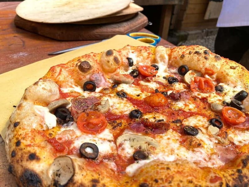 Rome: Combo Pizza and Pasta Cooking Class with Wine - Making pizza in a wood-fired oven