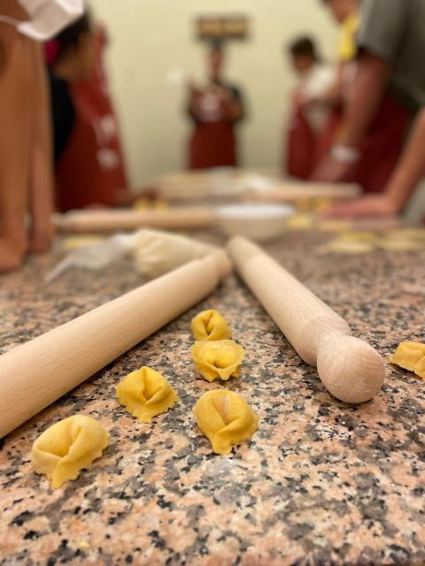 Rome: Pasta Making Class with Wine, Limoncello, and Dessert - The communal table, wine, dessert, and limoncello