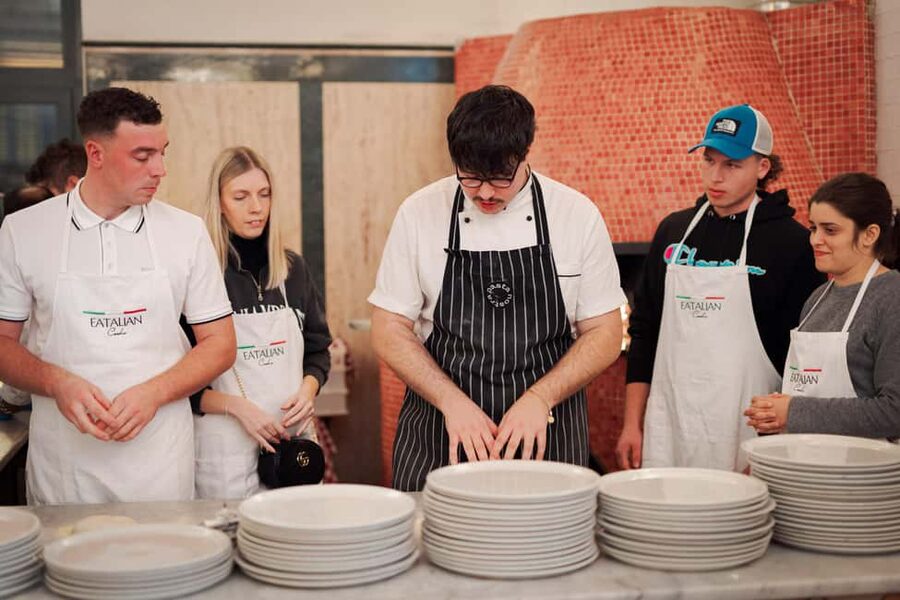 Rome: Pizza and Tiramisu Cooking Class in Piazza Navona - Rolling pizza dough like an Italian cook