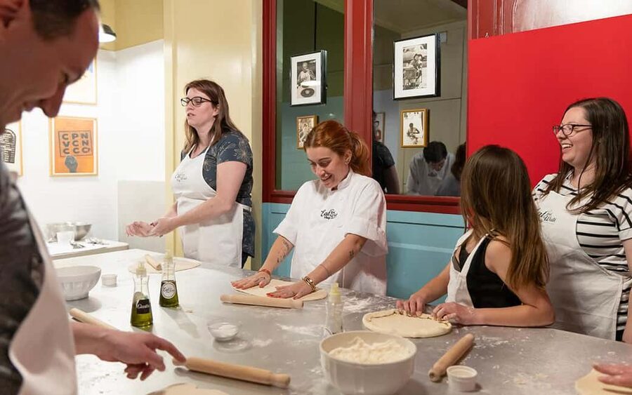 Rome: Pizza & Tiramisu Making Class with Wine & Limoncello - Kneading, stretching, and topping your own pizza