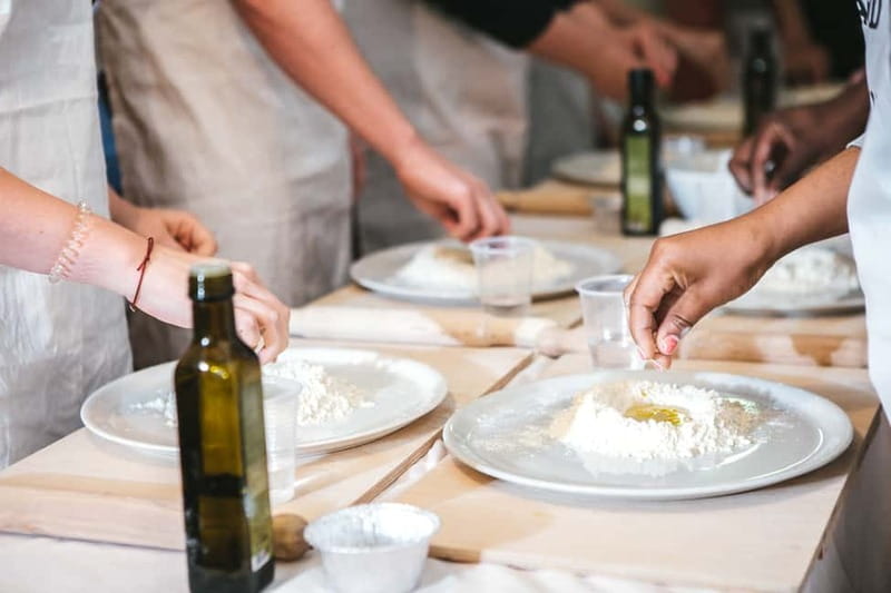 Rome: Pizza & Tiramisu Making Class with Wine & Limoncello - A meal with wine, water, and limoncello