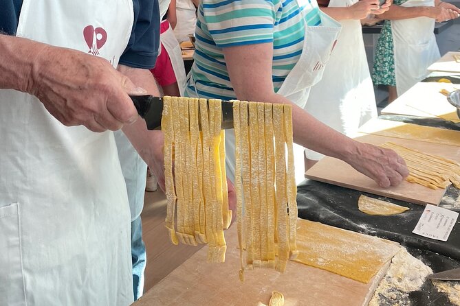 Rome Small Group Pasta Making Class with Wine and Italian Chef - From workbench to lunch table