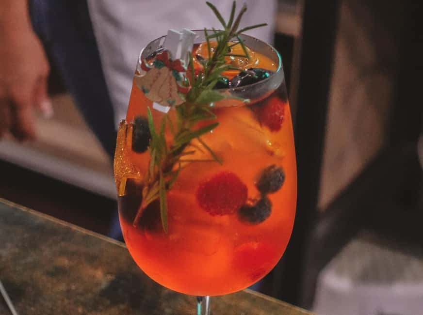 Rome: Spritz & Spaghetti Cooking Class - Sitting down for the meal and Limoncello