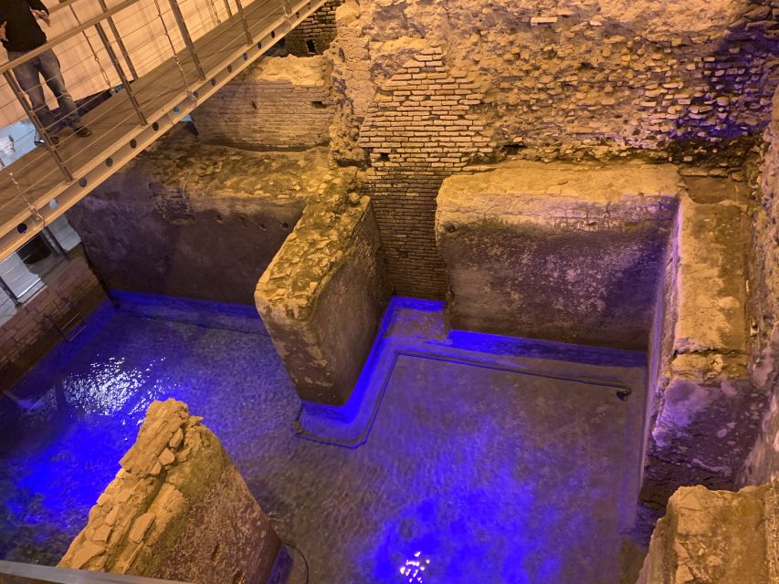 Rome: Trevi Fountain District Underground Domus Guided Tour - Ancient coins, amphorae, and the domus residence