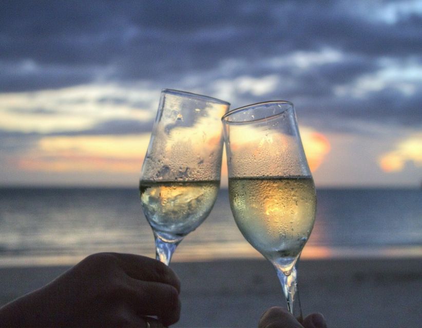 Sirmione: Sunset Boat Cruise with Local Wine - The first sights: harbor, castle, and old villas