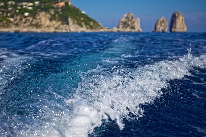Small Group Capri Island Boat Ride with Swimming and Limoncello - The Faraglioni stop and swimming time