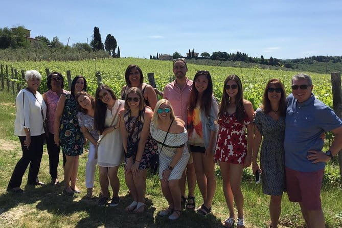 Small-Group Wine Tasting Experience in the Tuscan Countryside - First winery: vineyard, production area, and barrel room