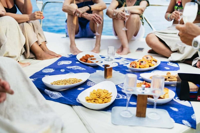 Taormina: Sunset Boat Tour with Dolphin Watching & Aperitif - Cape Taormina, Cape Schisò, and the rocky landmarks